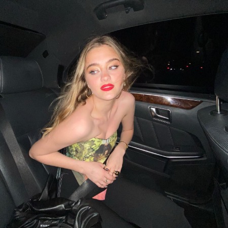 Lizzy Greene in a lavish car.